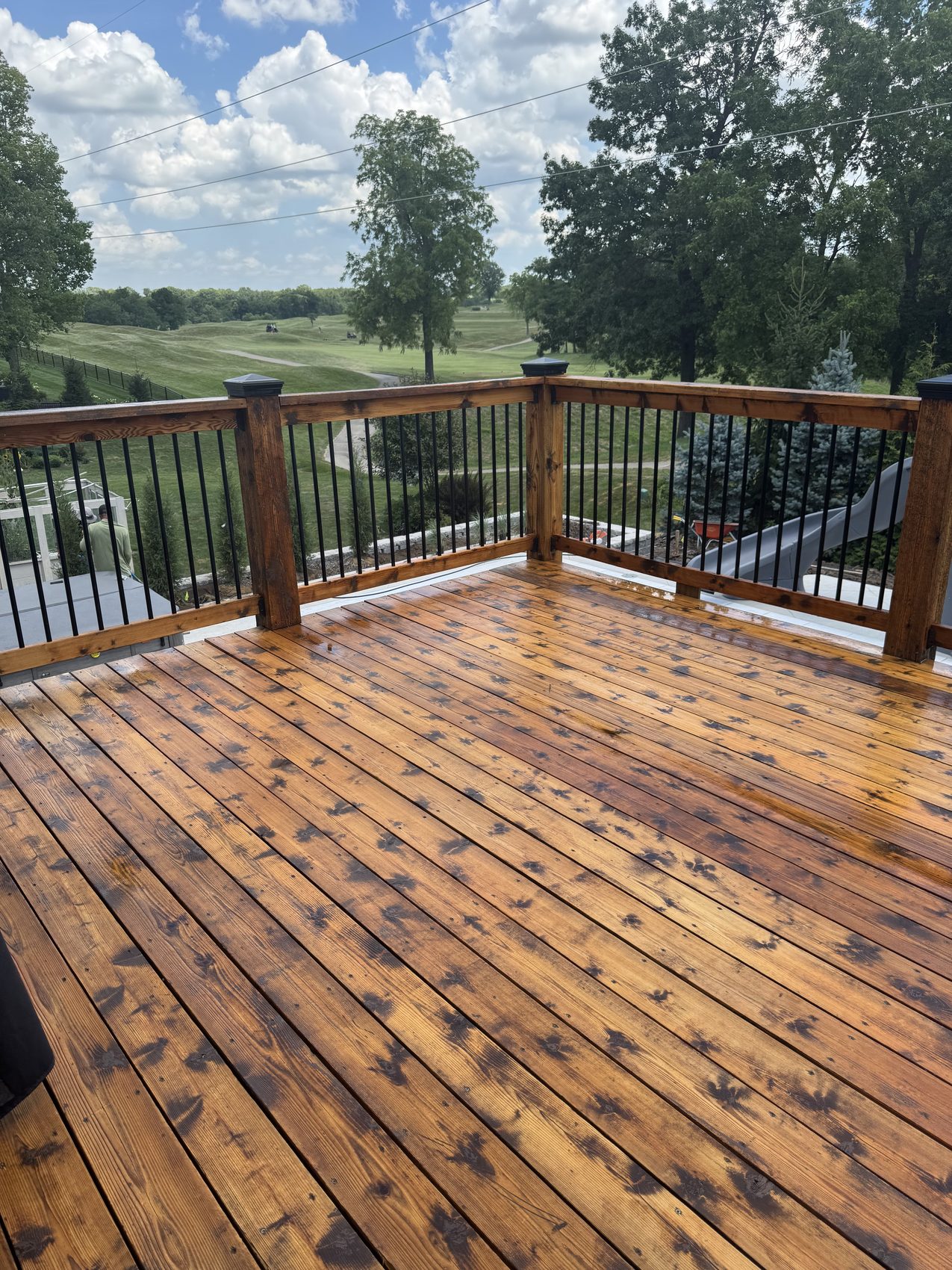 A freshly stained cedar deck in Kansas City