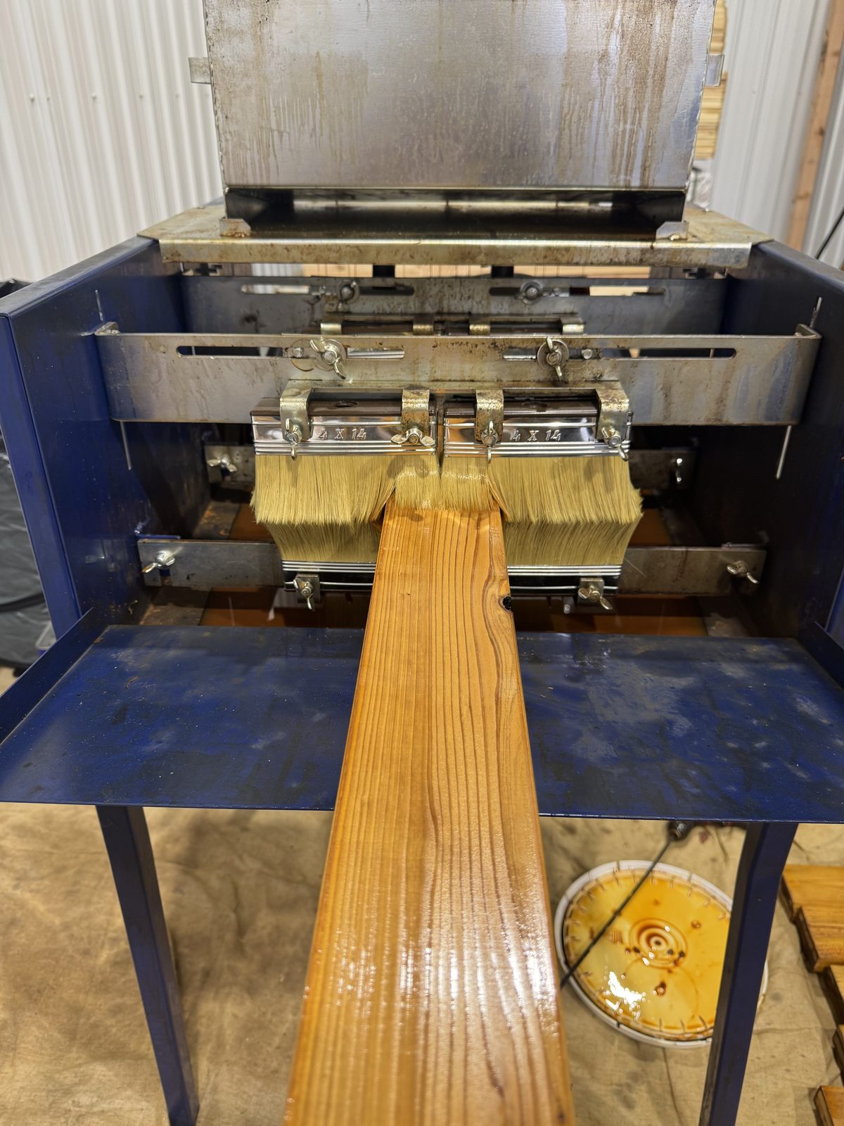 Cedar board through the stain machine, pre-staining staining in Kansas City by Staining Grain