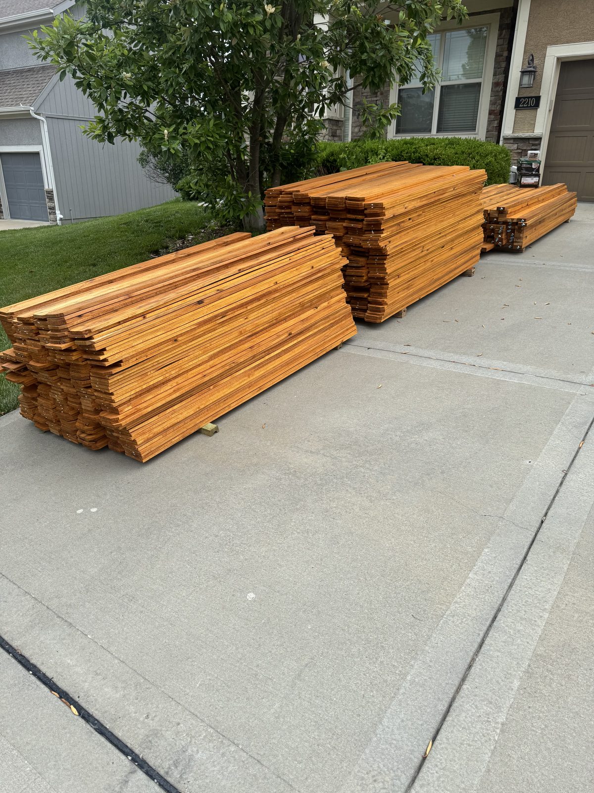 Stacks of pre-stained cedar, pre-staining staining in Kansas City by Staining Grain