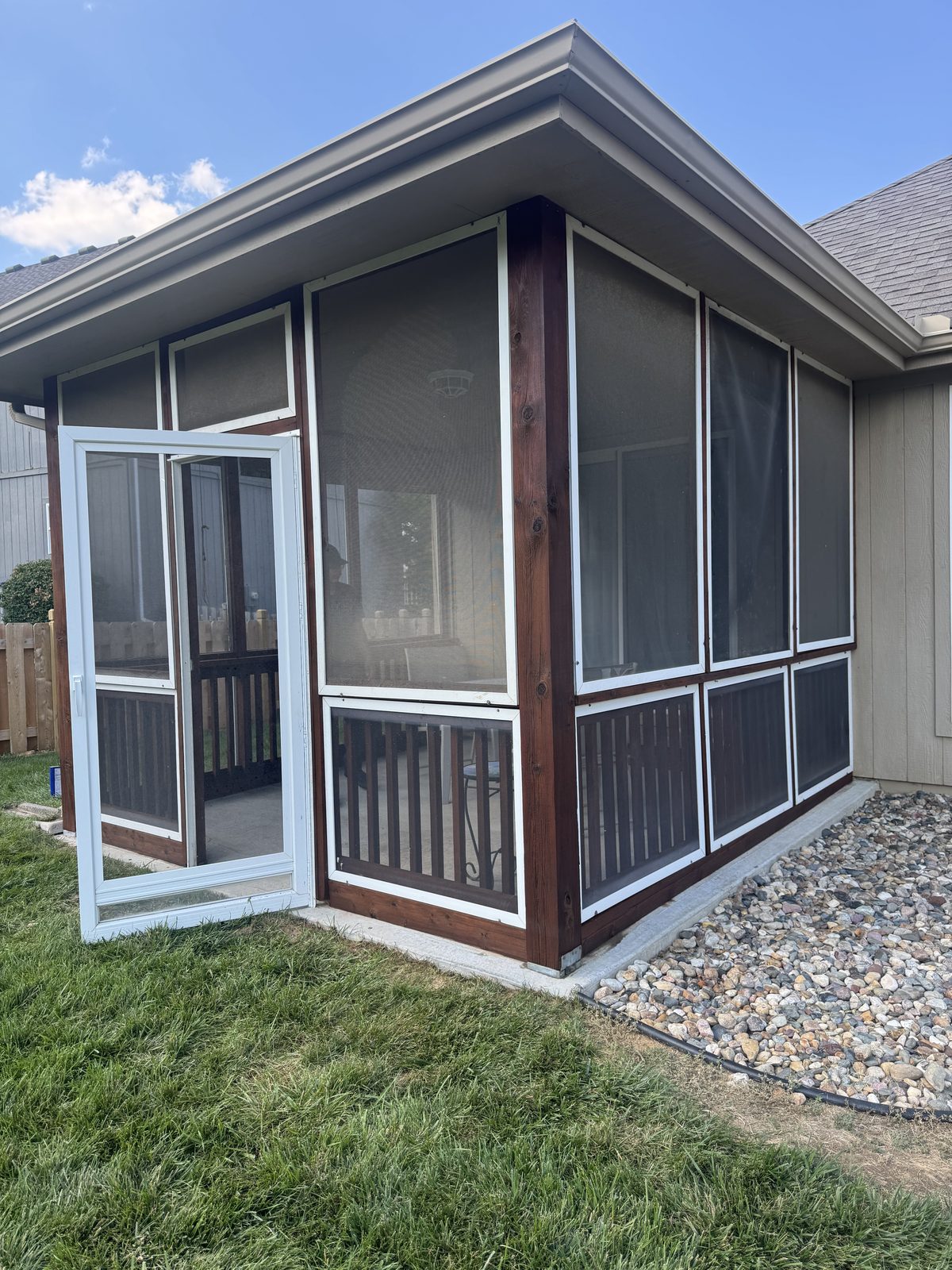 Screened porch with walnut stained posts, pergolas staining in Kansas City by Staining Grain