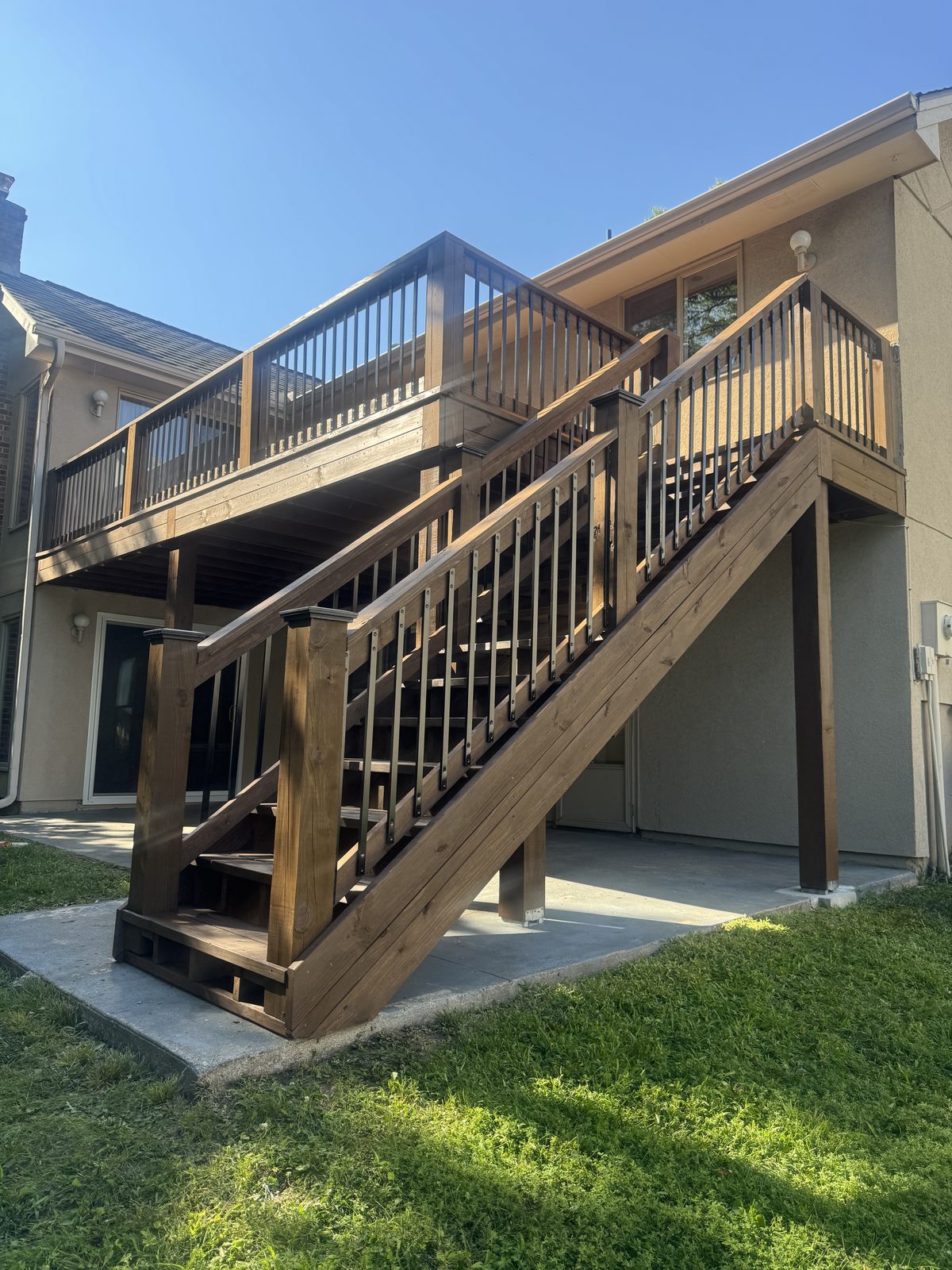 Elevated deck and stairs, warm brown stain, decks staining in Kansas City by Staining Grain