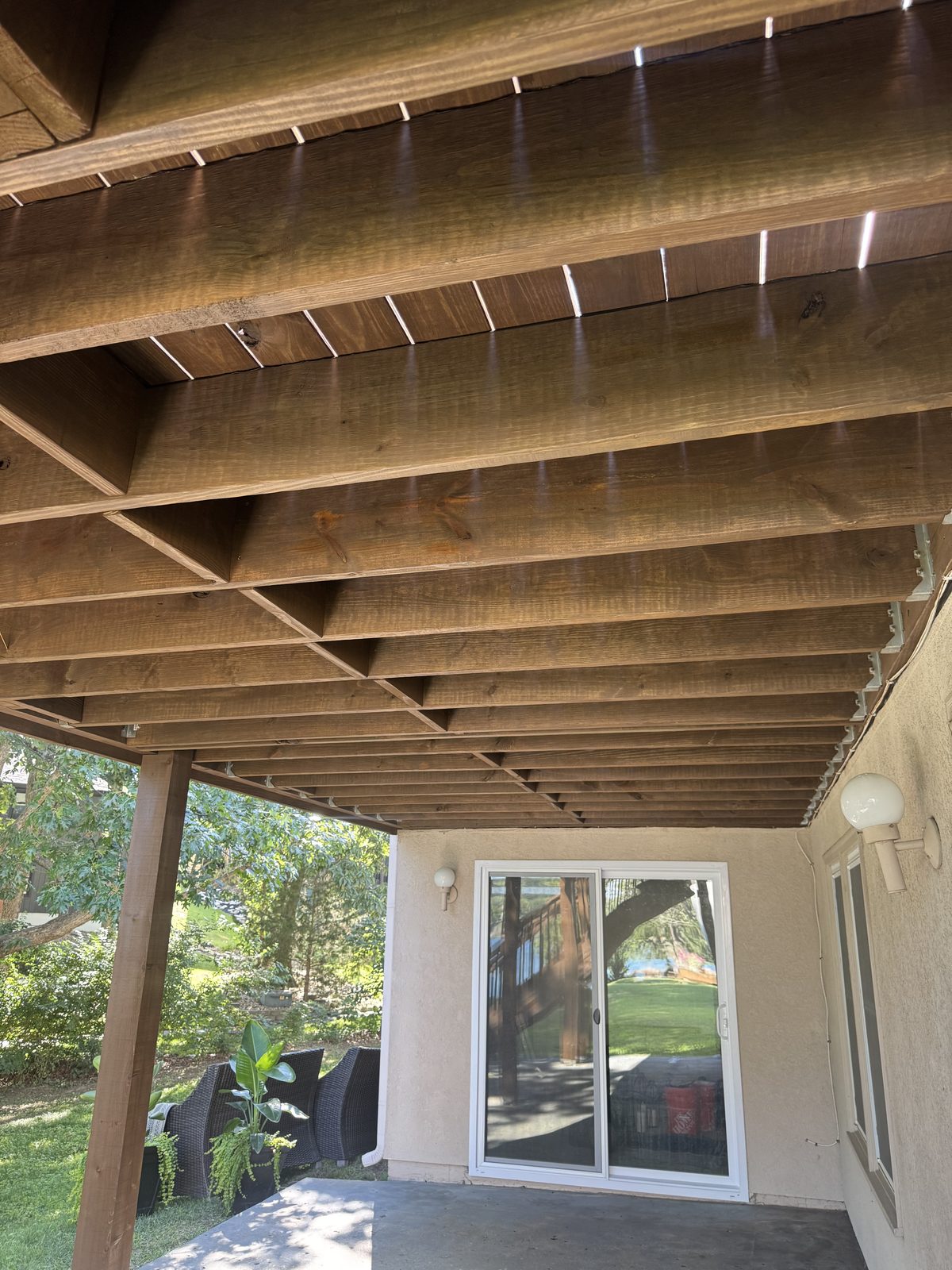 Underside of an elevated deck, stained beams, decks staining in Kansas City by Staining Grain