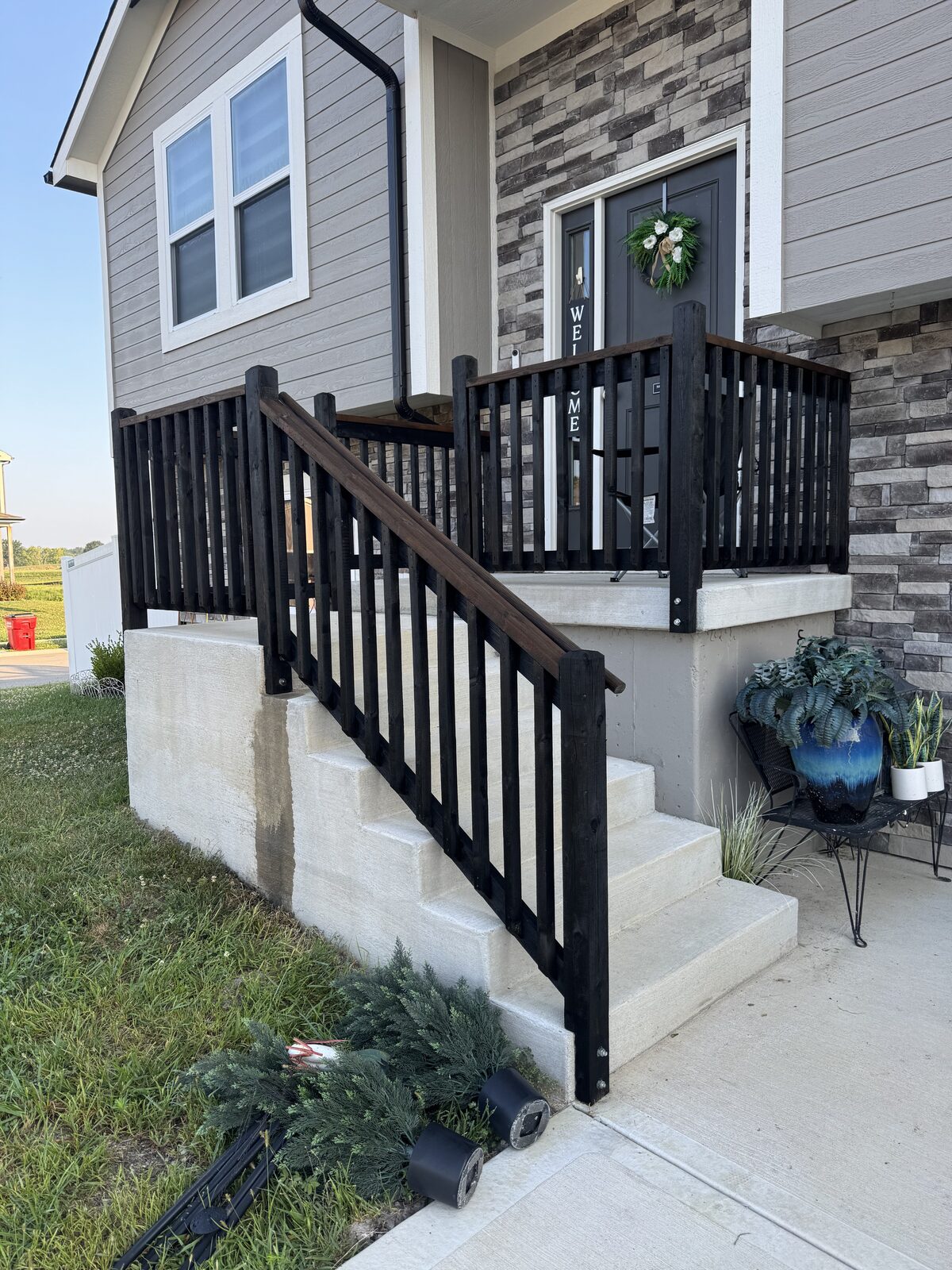 Black stained deck stairs and railing